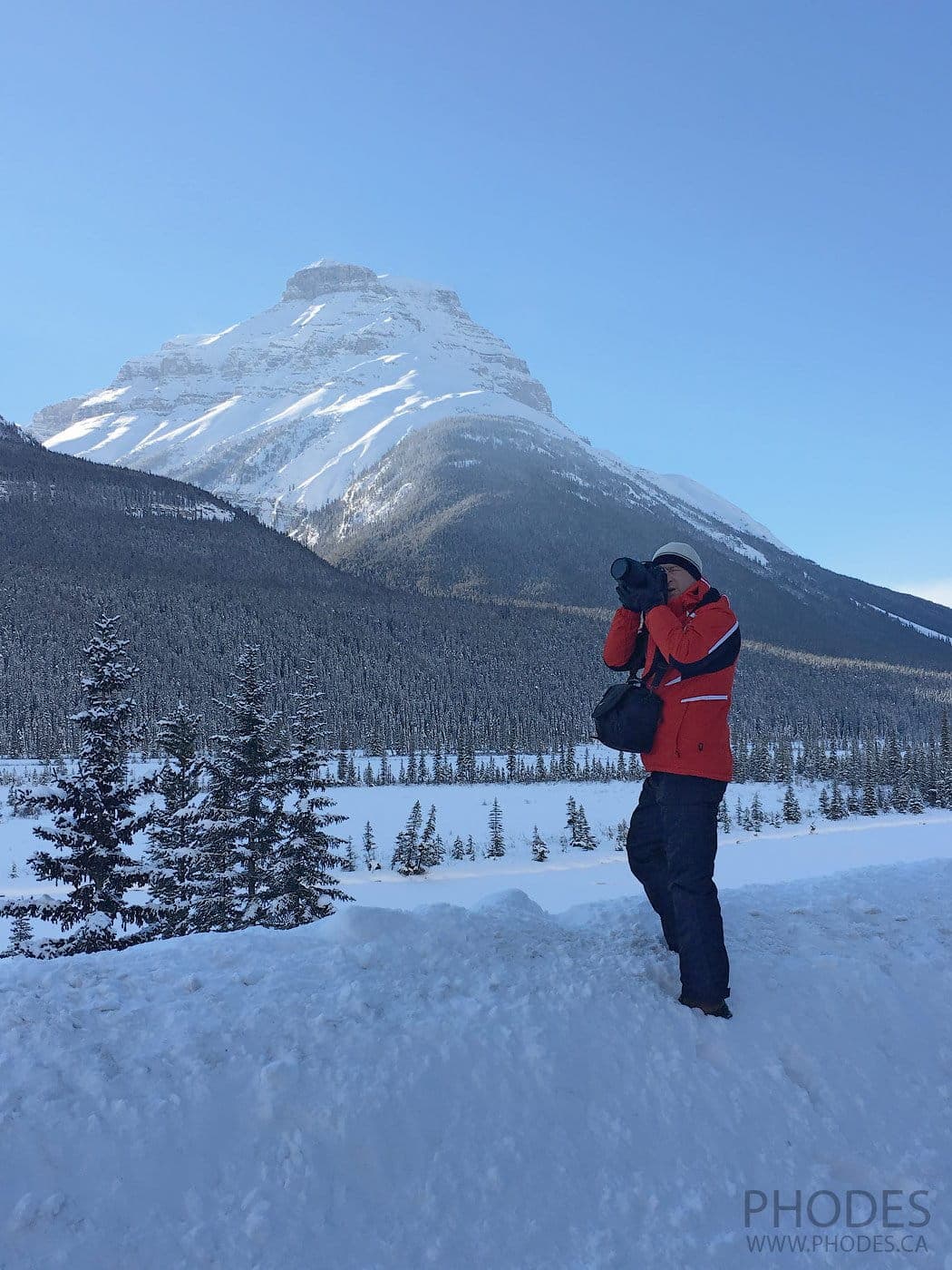 Photographer taking picture in winter Banff